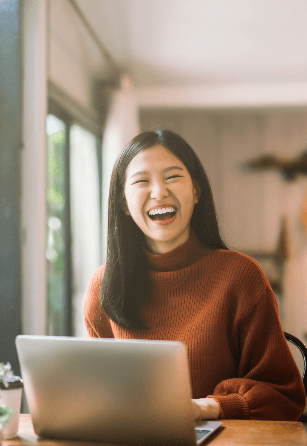 Child laughing with teacher